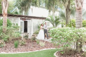 Bride walking down the aisle at Paradise Cove captured by top Orlando wedding photography and videography team