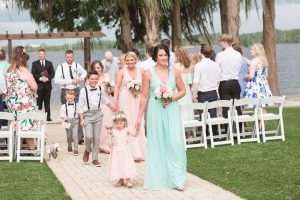 Bridal party walking down the aisle at Paradise Cove at top wedding venue in Orlando, Florida