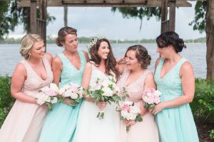 Bridal party laughing with the bride at Paradise Cove at top wedding venue in Orlando, Florida