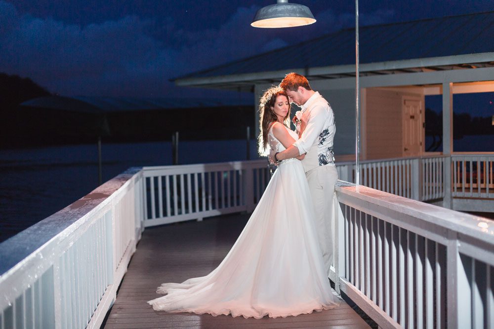 Gorgeous nighttime portraits of the bride and groom at Paradise Cove captured by top Orlando wedding photographer