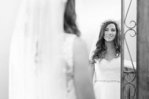Bride getting ready at Paradise Cove captured by top Orlando wedding photographer and videographer