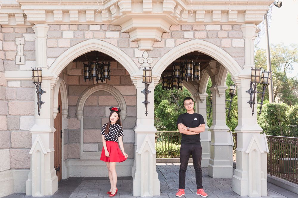Fun and playful photography session at Walt Disney World castle in the theme park captured by top Orlando wedding and engagement photographer