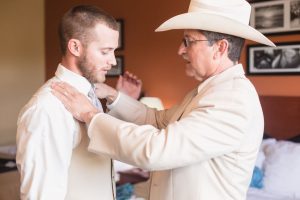 Groom and his dad getting ready for their country wedding day at a barn north of Orlando Florida
