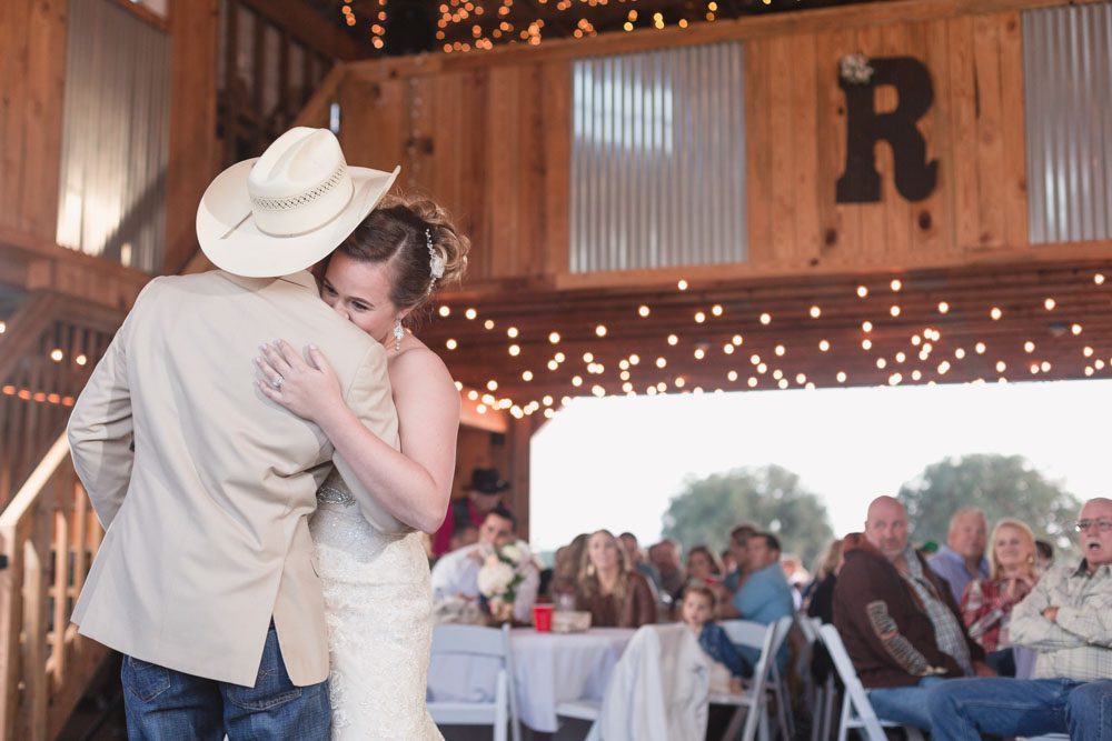 Bride shares a first dance with her groom at their barn wedding reception north of Orlando