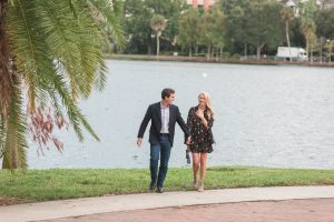 Photo of a surprise proposal in downtown Orlando at Lake Eola captured by top Orlando engagement and wedding photographer