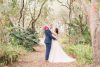 Top Orlando wedding photographer captures romantic photo of the bride and groom in the forest during their intimate DIY wedding in Kissimmee