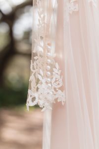 Detail on the sleeve of this wedding dress for an intimate backyard wedding in Kissimmee Florida captured by top Orlando wedding photographer