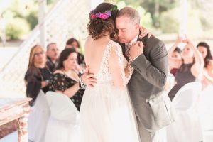 Bride shares an emotional first dance with her dad during their outdoor wedding reception in a backyard in Kissimmee, Florida