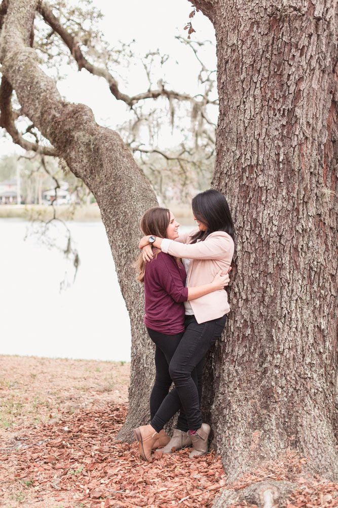 Romantic and candid engagement photography in downtown with two future brides captured by Orlando LGBT photographer
