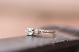 Close up of vintage style engagement ring during an engagement photography session in Orlando, Florida