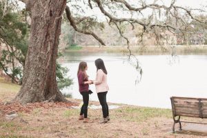 Orlando photographer captures surprise lesbian marriage proposal in the park by the lake in downtown Orlando