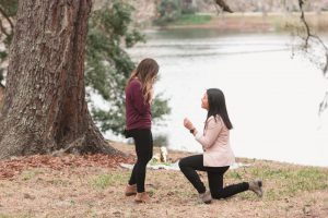 Photography of a surprise proposal by the lake at a park captured by top Orlando lgbt same-sex photographer