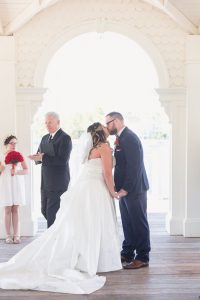 Couple shares their first kiss during their Disney wedding by top photographer in Orlando