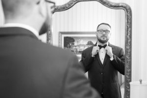 Groom getting ready at the Disney Yacht Club for his wedding ceremony at Sea Breeze Point in Orlando