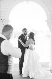 First dance featuring a violinist at Sea Breeze point at the Boardwalk Inn captured by top Orlando wedding photographer