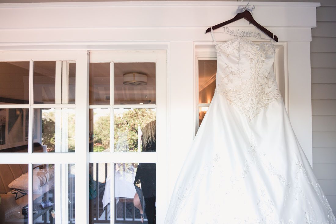 Detail shot of the brides dress for her Disney wedding day in Orlando, Florida with photography and videography by Captured by Elle