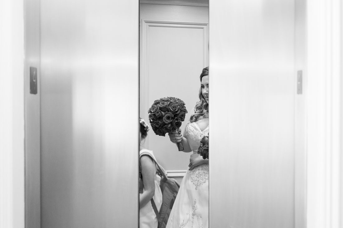 Orlando wedding photographer captures the moment the bride gets on the elevator for her Disney wedding day