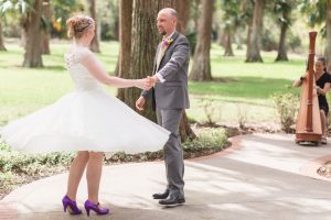 Intimate Orlando wedding photography at Cypress Grove featuring the bride in a short tea length dress with a Tangled Disney theme