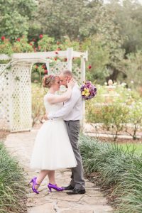 Wedding photographer in Orlando captures romantic portraits of the bride and groom in the garden at Cypress Grove Estate House Park in Central Florida