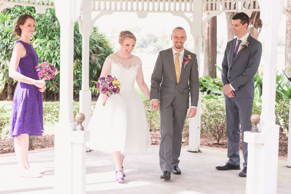 Orlando wedding photographer captures intimate wedding ceremony under a gazebo at Cypress Grove Estate House Park in Orlando, FL
