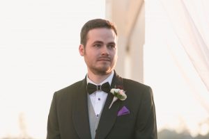 Grooms reaction to seeing his partner down the aisle at their outdoor wedding at Cypress Grove park in Orlando Florida