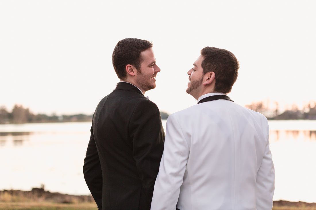 Gay wedding inspiration with grooms wearing black and white tuxes during their Orlando wedding day