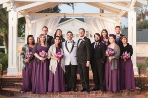 Photo of the wedding party featuring purple dresses at Cypress Grove Estate House wedding in Orlando, Florida