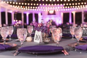 Purple violet lilac wedding decor at outdoor venue in Orlando captured by top Orlando wedding photographers