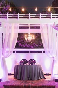 Purple violet lilac wedding decor at outdoor venue in Orlando captured by top Orlando wedding photographers