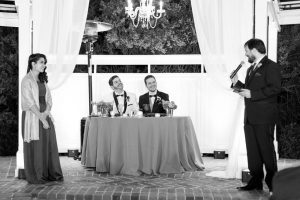 Grooms receiving a toast at their gay wedding in Orlando at Cypress Grove Estate House