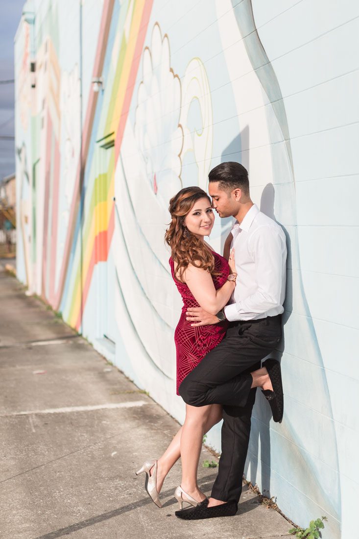 Orlando engagement photography with art murals around downtown by top Orlando wedding photographers