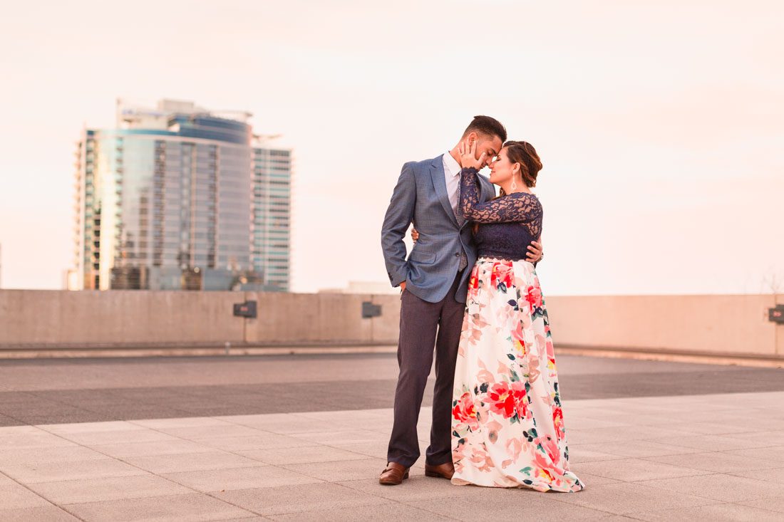 Rooftop engagement photo taken in downtown Orlando at the Balcony by wedding photographer at sunset