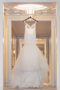 Bride's dress hanging in the hallway of the Four Seasons resort for their Orlando wedding day