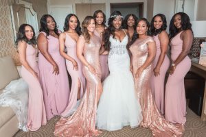 Bridesmaids and bride at the Four Seasons wearing blush pink and gold sequin dresses