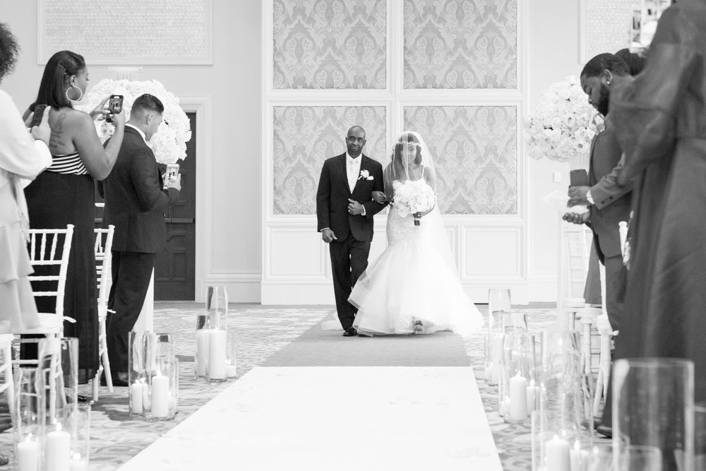 Photo of bride entering her wedding ceremony at the Four Seasons resort in Walt Disney World in Orlando