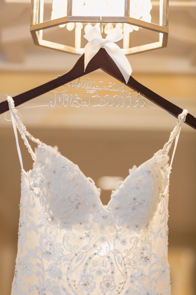 Bride's personalized dress hanger in the hallway of the Four Seasons resort for their Orlando wedding day