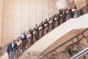 Bridal party portrait on the iconic steps of the Four Seasons in Orlando captured by top wedding photographer in Orlando