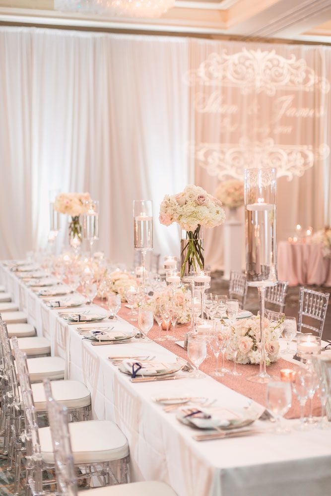 Blush pink and ivory decor for Four Seasons wedding reception captured by Orlando wedding photographer and videographer