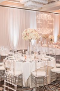Blush pink and ivory decor for Four Seasons wedding reception captured by Orlando wedding photographer and videographer
