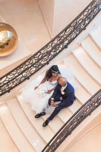 Couples portrait on the stairs at the Four Seasons resort in Orlando captured by top photographer in Central Florida