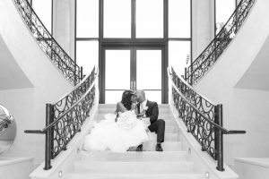 Couples portrait on the stairs at the Four Seasons resort in Orlando captured by top Disney photographer