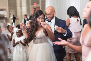 Fun and candid wedding reception dancing photos captured by top Orlando wedding photographer at the Four Seasons resort at Disney