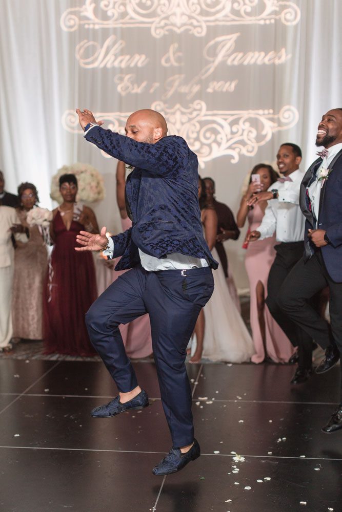 Groom dances with his fraternity brothers during this Orlando wedding reception