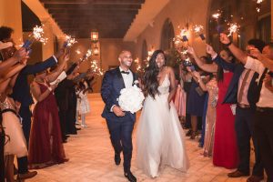 Orlando wedding photographer and videographer capture the couples sparkler exit from their wedding at the Four Seasons at Disney