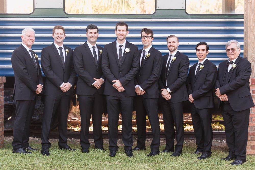 Groom and groomsmen photo at the Estate on the Halifax train captured by top Orlando wedding photographer