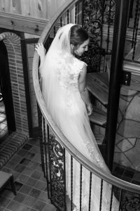 Portrait of the bride on the spiral staircase at the Estate on the Halifax venue captured by top Orlando photography team