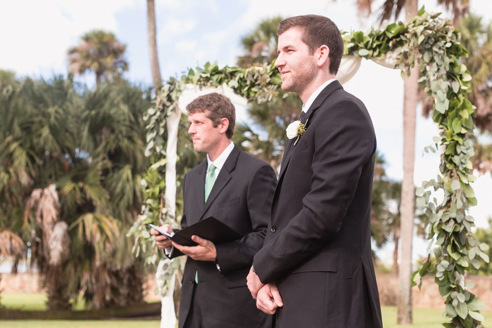 Groom sees bride down the aisle at their outdoor wedding at the Estate on the Halifax east of Orlando