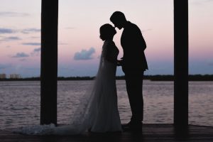 Silhouette of the bride and groom on the water at the Estate on the Halifax east of Orlando