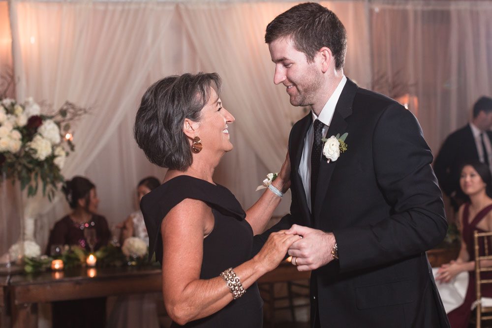 Photo of the groom sharing a first dance with mom during their Estate on the Halifax wedding reception near Orlando