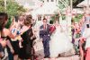 Grand exit with rose petals at Disney's wedding pavilion by Orlando wedding photographer